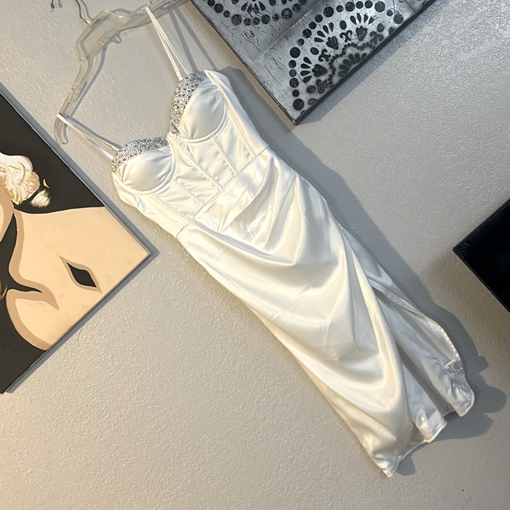 Never worn. Fashion nova, silky white, corset top, long dress with slit.